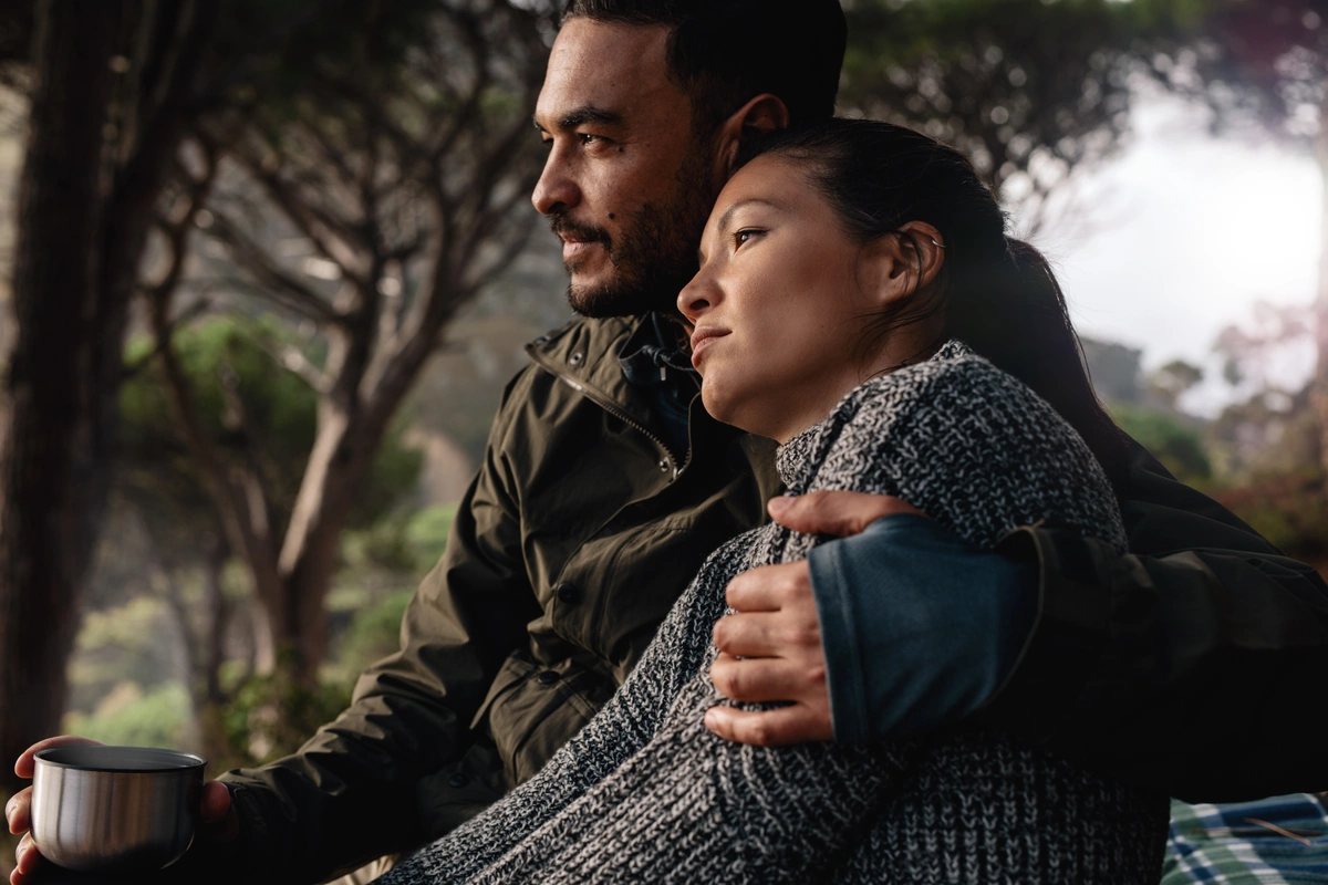 Couple comforting each other and considering their fertility options after breast cancer diagnosis