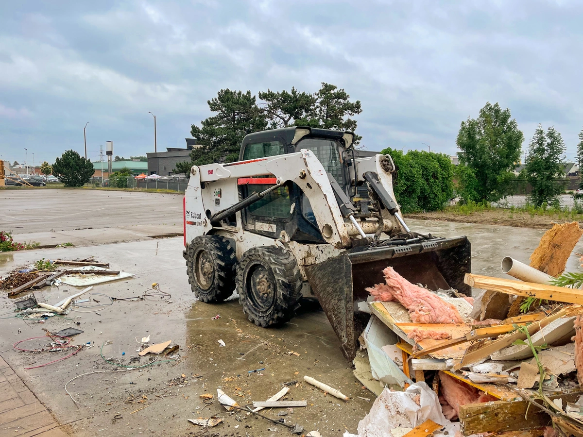 skid steer moving debris