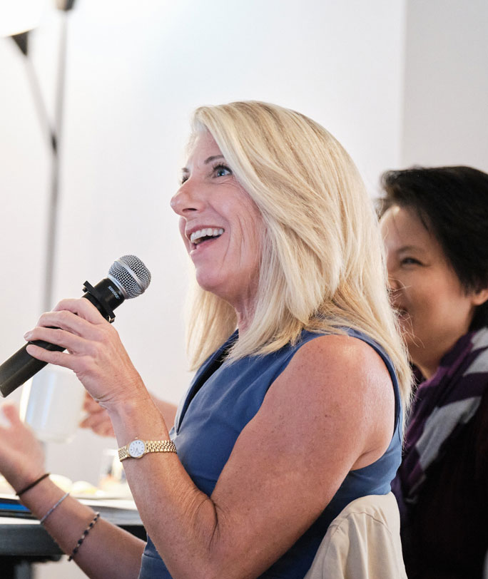 A Female Entrepreneur discussing entrepreneurial concepts at a workshop