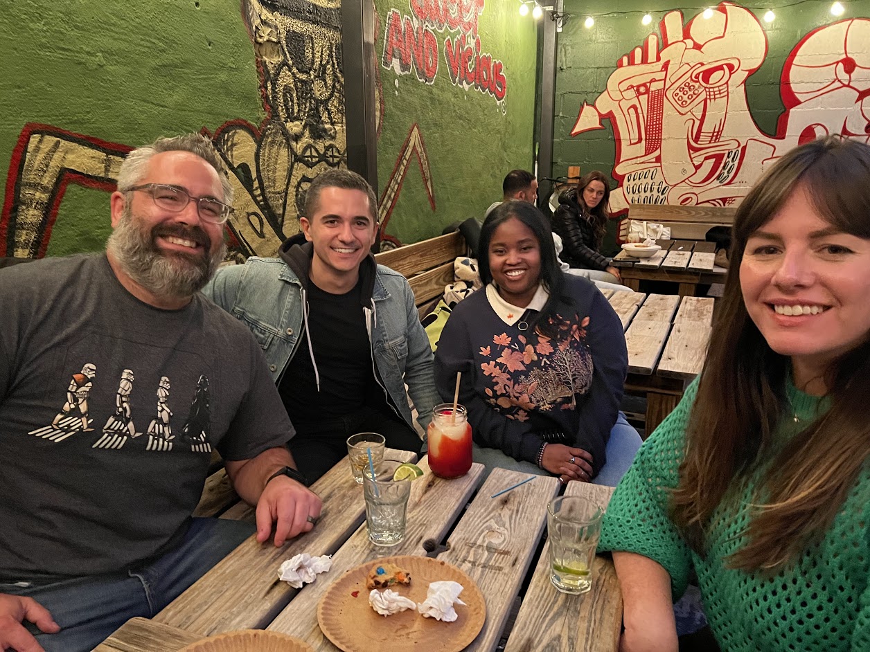 TeePublic employees smiling at a restaurant