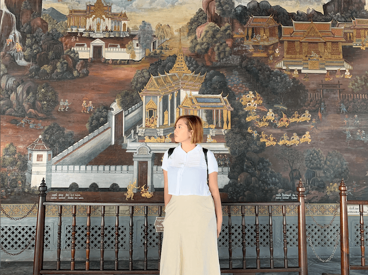 me with a mural background in Grand Palace