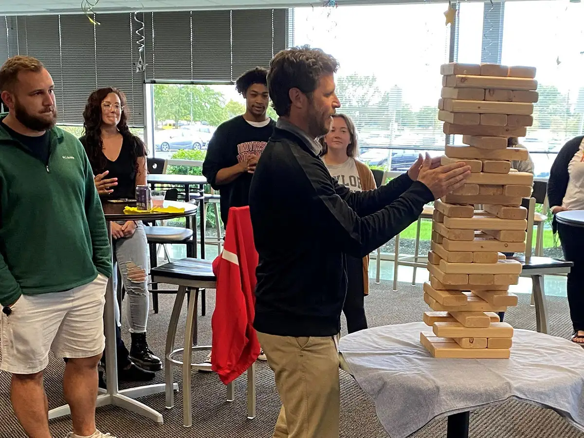 Team playing Jenga.