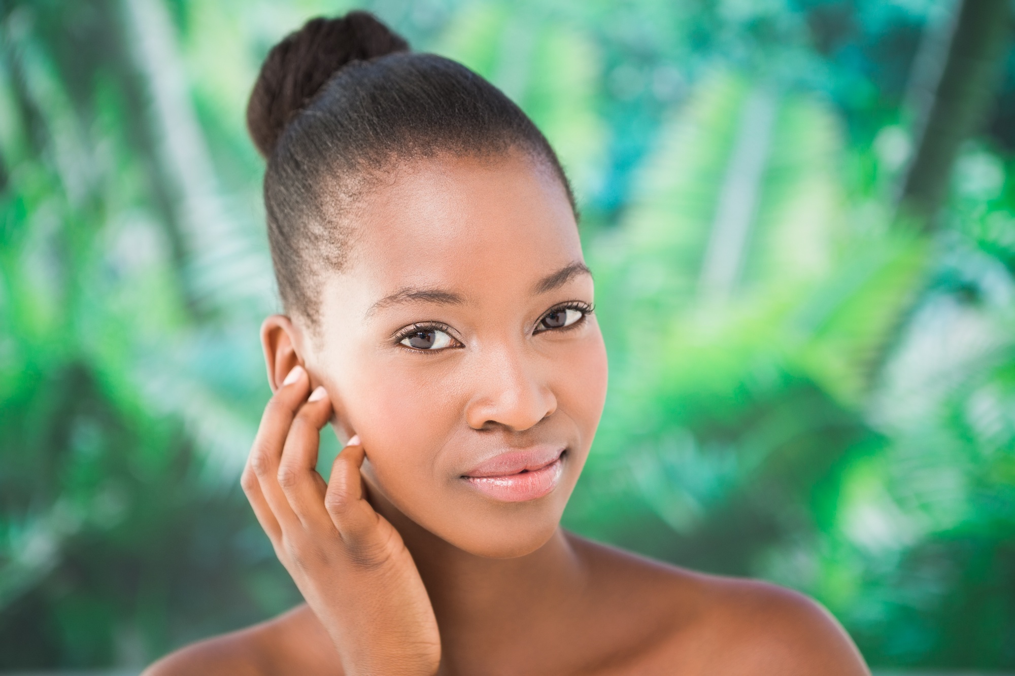 Hearing loss from ear infection: A woman holds her hand near her ear