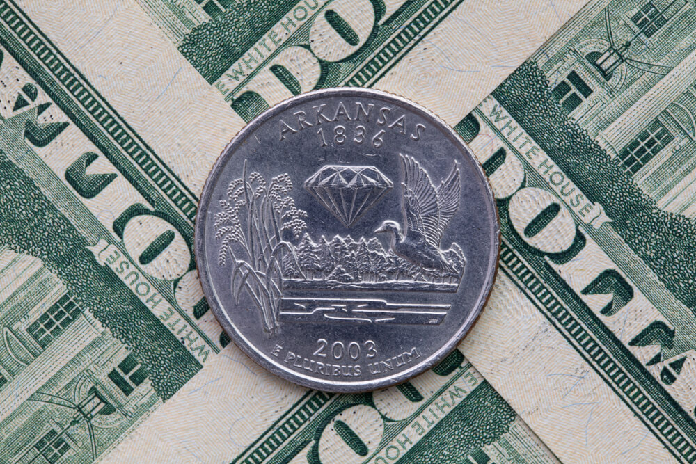 Arkansas coin on some cash