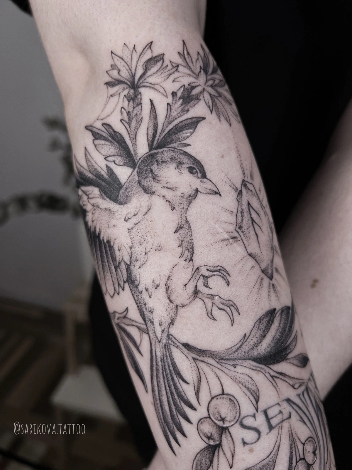 amazing dotwork bird tattoo among leafs