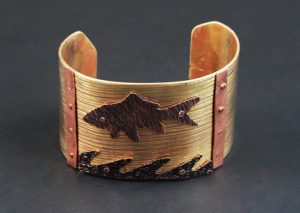 Cuff bracelet with fish and water detail
