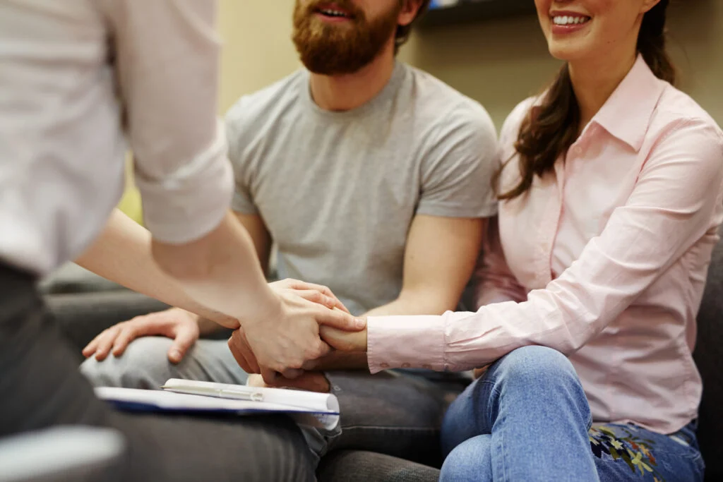 couple discussing shared risk IVF with consultant