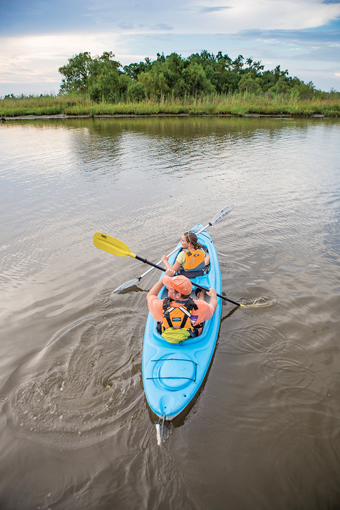 People kayaking at The Mobile-Tensaw Delta