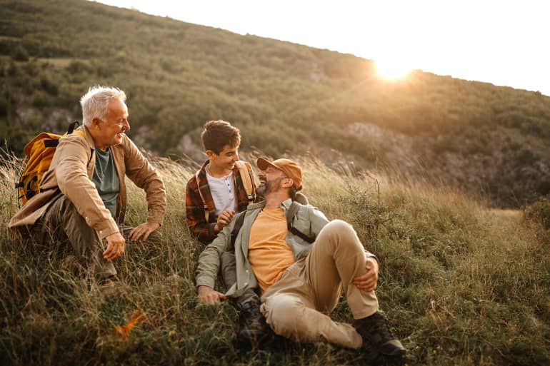 grandfather, dad and son on hike