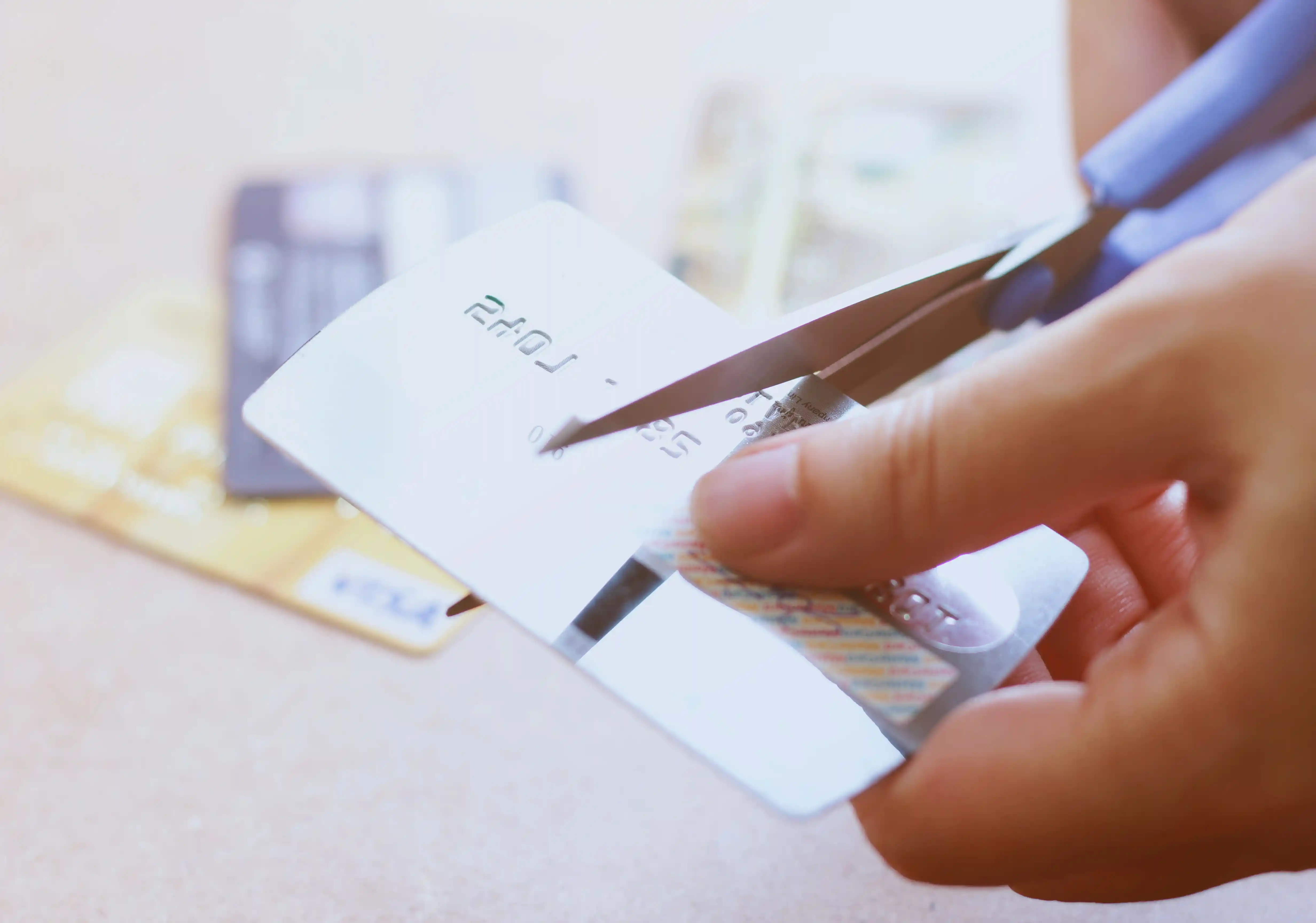 Cutting credit card representing cost reduction and operational efficiency