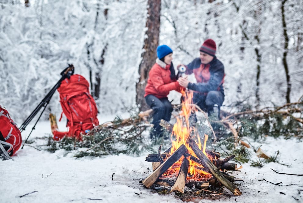 couple at winter campfire