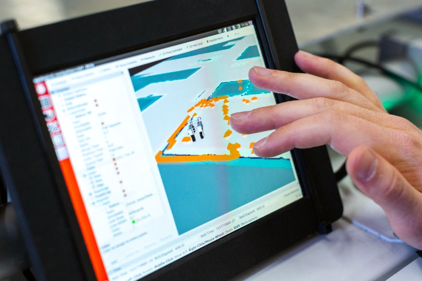 Hand using an ipad showing a 3D model