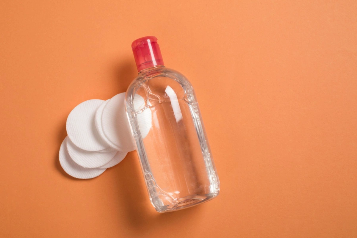 A bottle of micellar water with pads