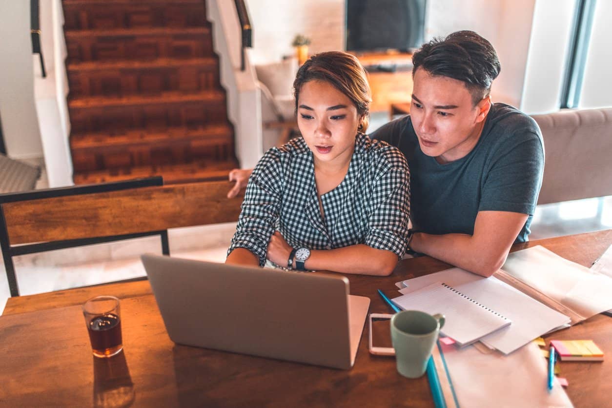 asian couple researching fertility options