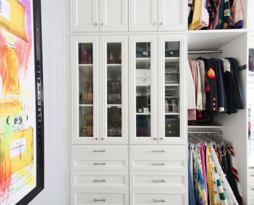 White storage space with pull-out cabinets