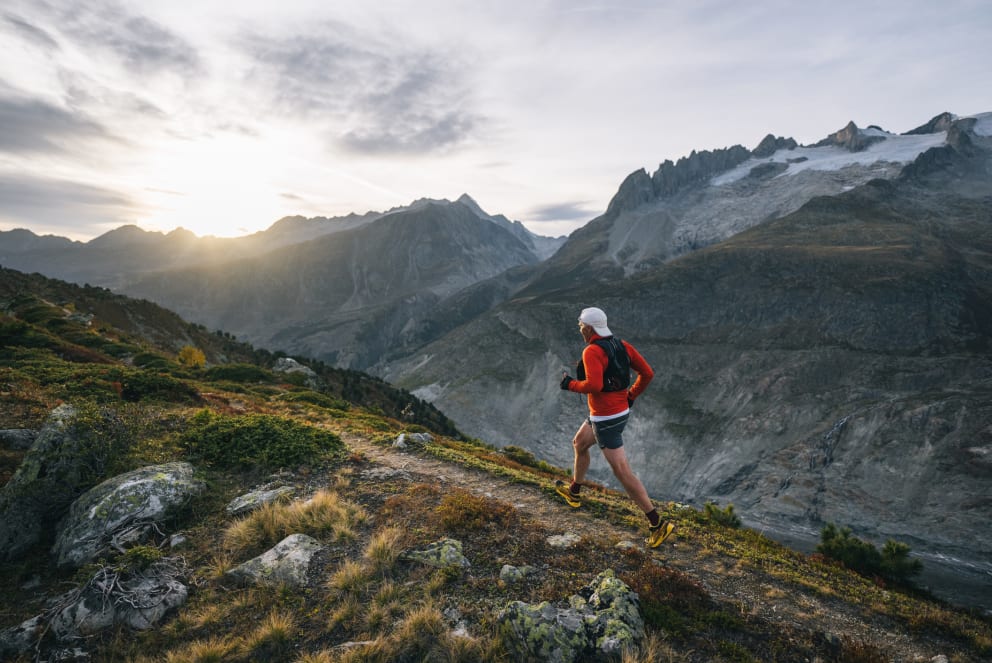 man trail running in mountains