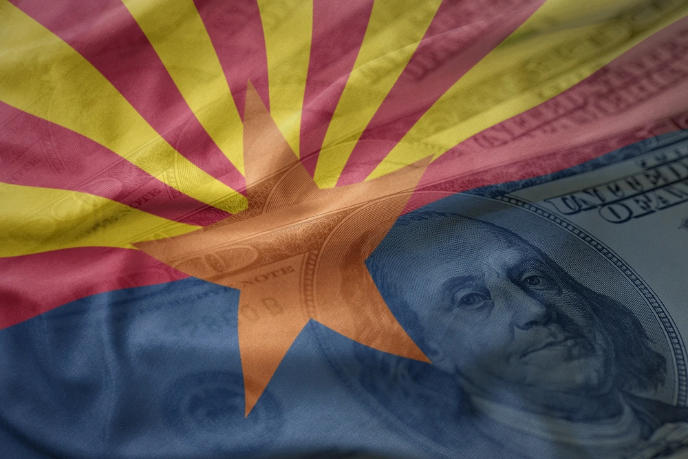 waving flag of Arizona state on a American dollar money background