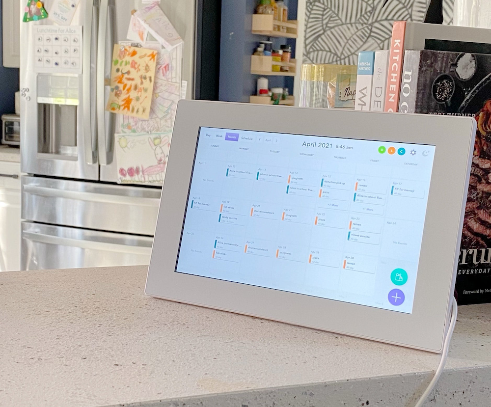 Calendar displaying month view of events on kitchen counter
