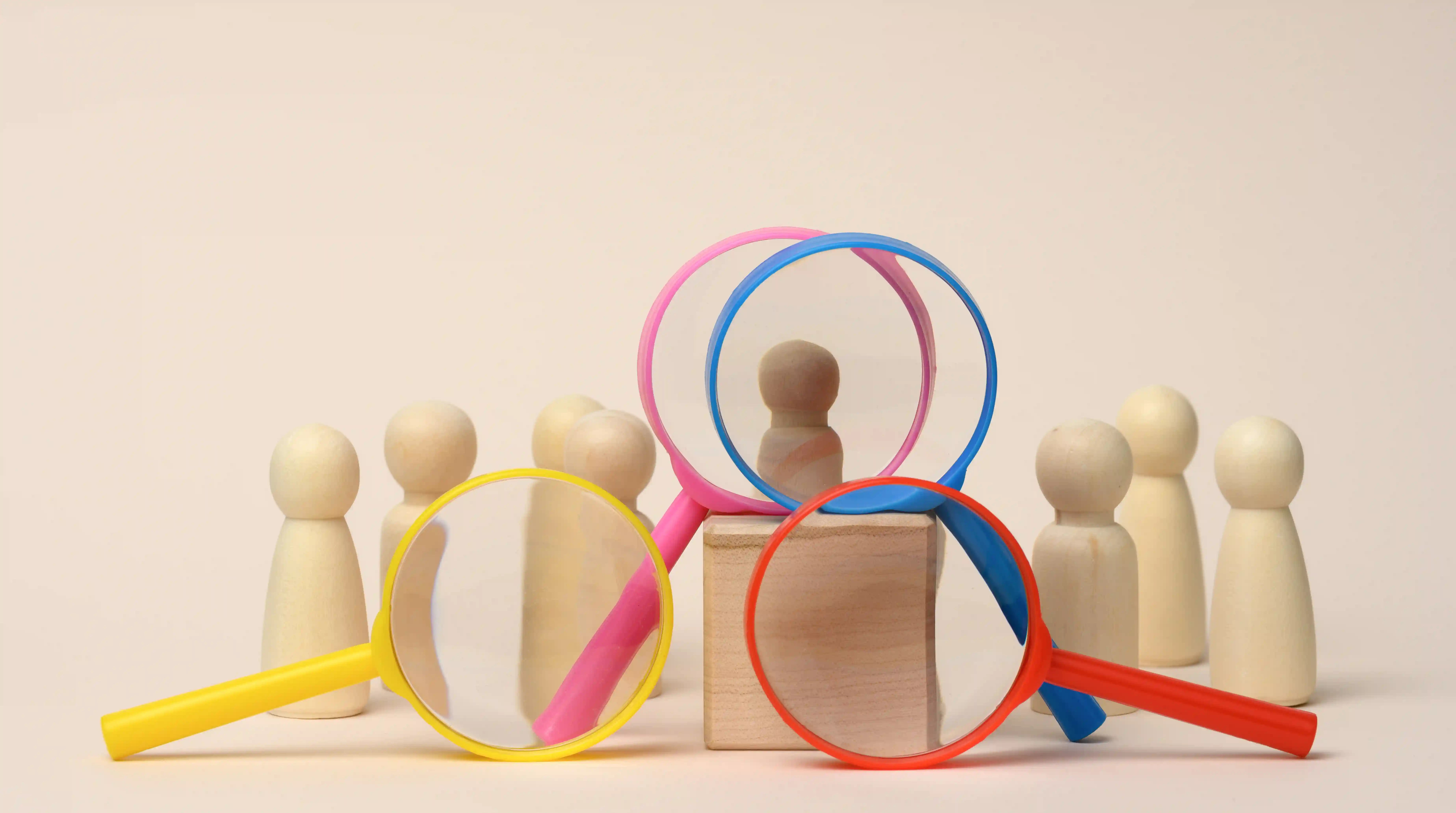 Talent selection concept with magnifying glasses highlighting candidate evaluation process