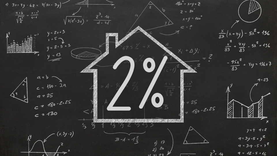 House drawn on a chalkboard with 2% inside and equations