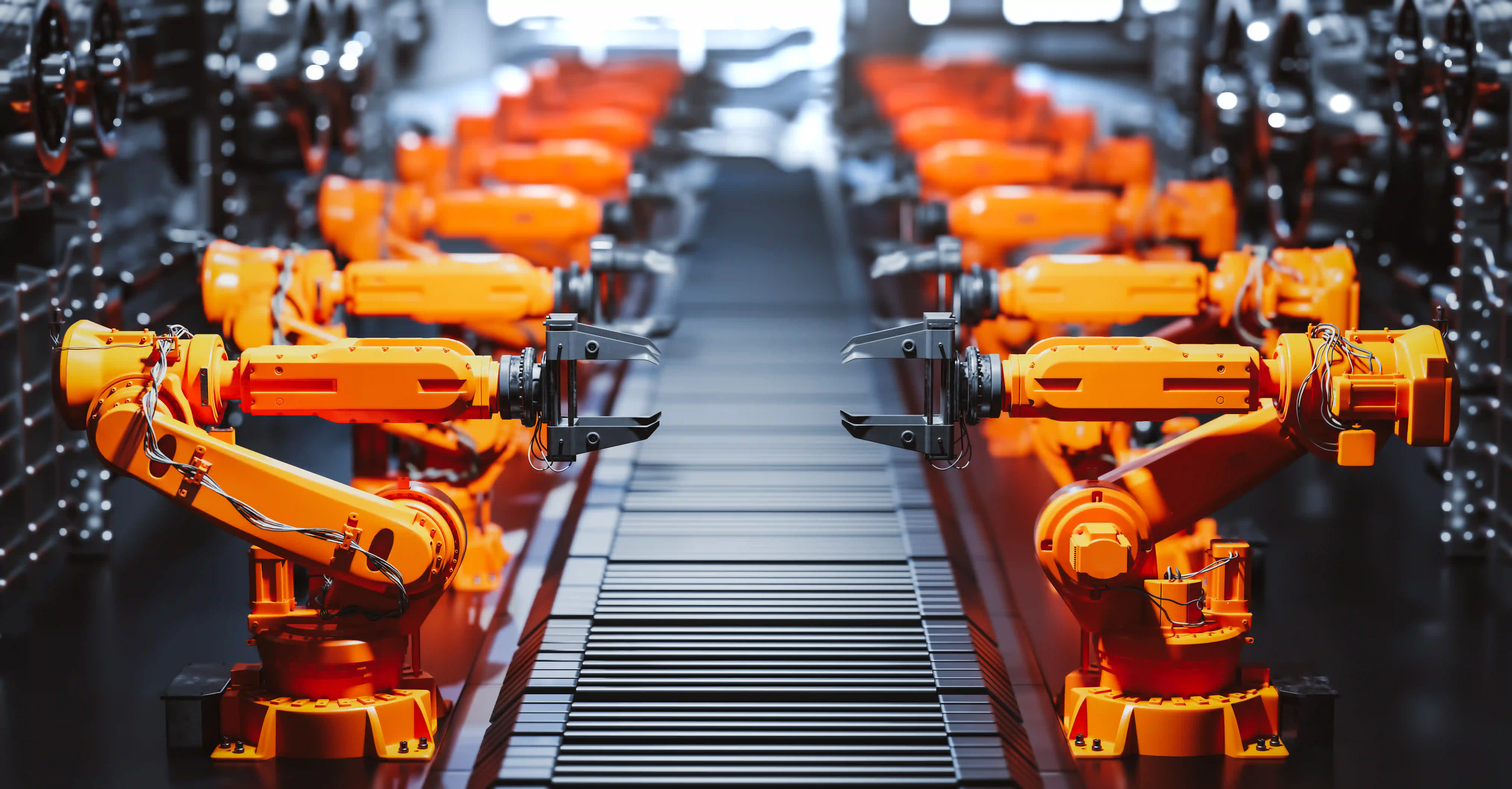 Robotic arms on production line representing automation and scalable operational systems