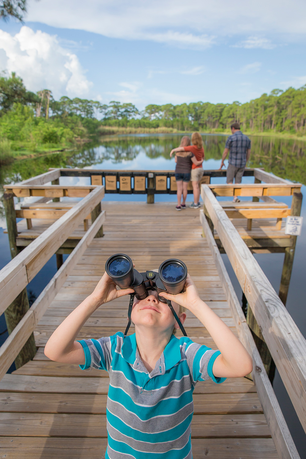 Child bird watching at Alabama Coastal Birding Trail