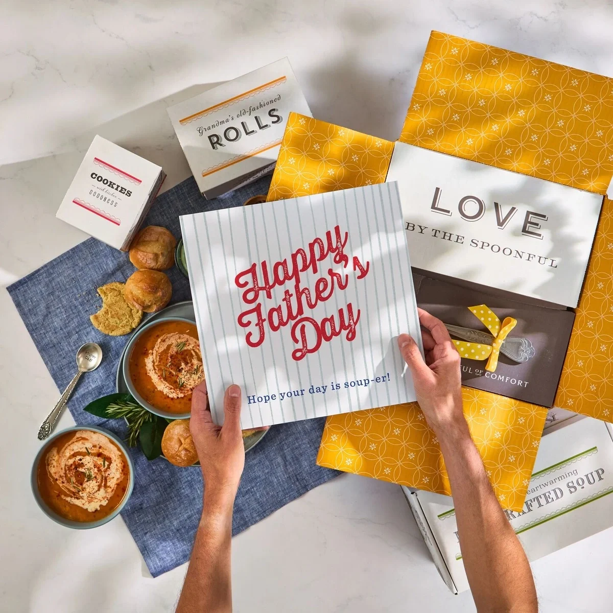 Father's Day package unboxing with soup, rolls and cookies