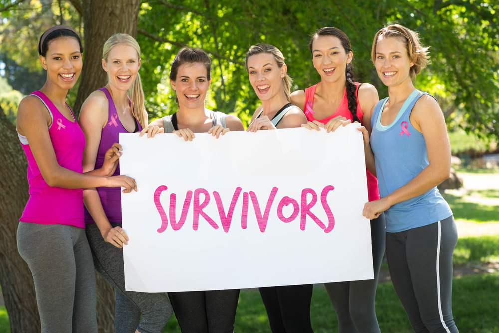 women holding survivors sign