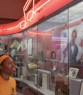 Person looking at pictures at Alabama Jazz Hall of Fame