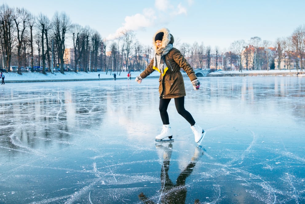 woman iceskating on lake