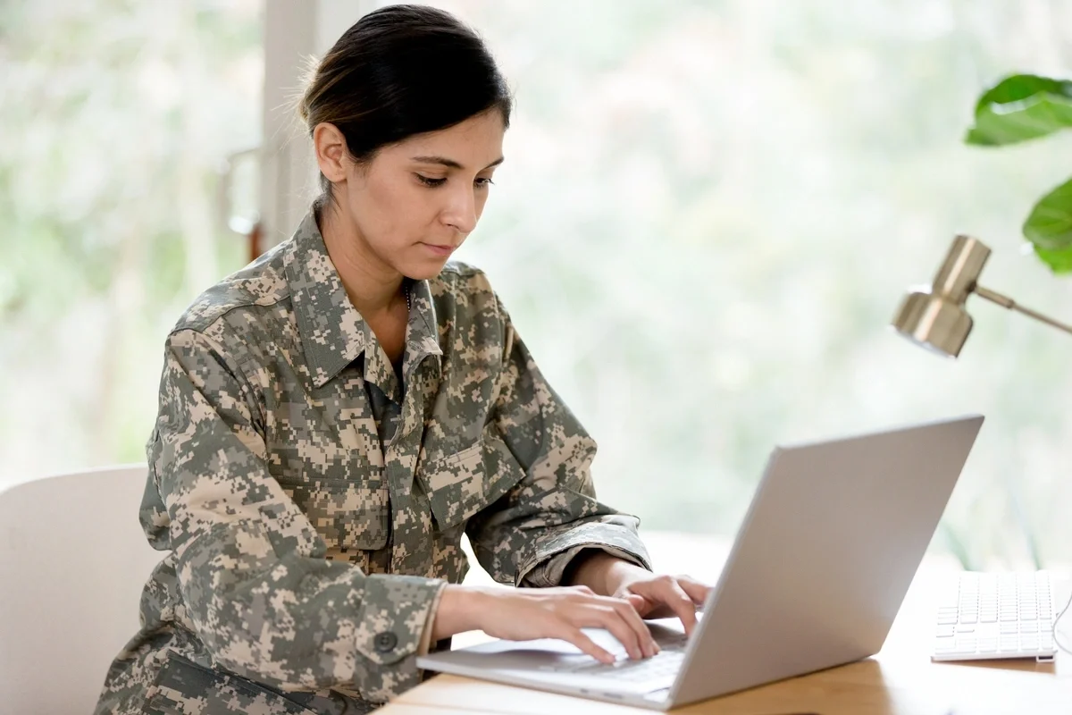 Military woman using her computer