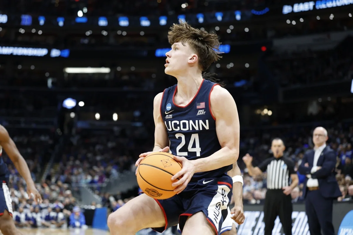 Mar 29, 2026; Washington, DC, USA; UConn Huskies guard Braylon Mullins (24) prepares to shoot the ball against the Duke Blue Devils in the second half during an Elite Eight game of the East Regional of the men's 2026 NCAA Tournament at Capital One Arena.