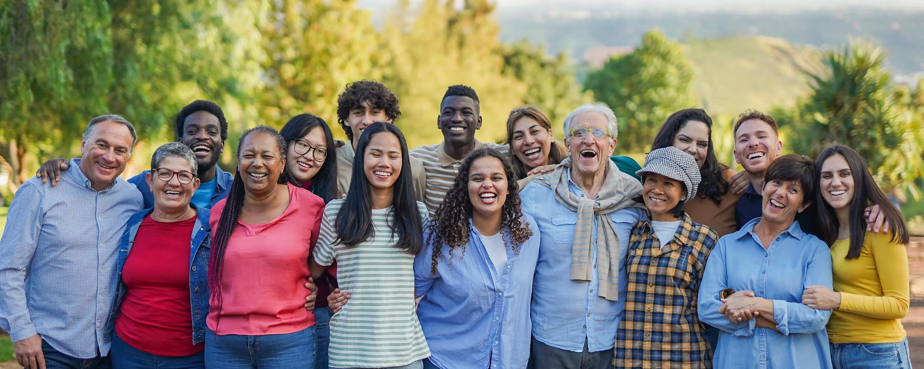 Diverse group of professionals smiling together outdoors