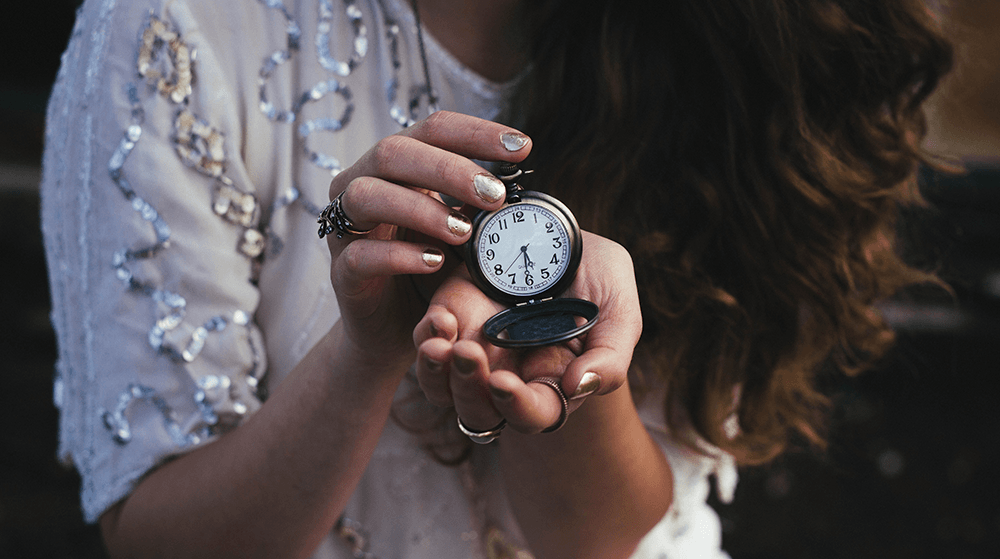 Woman holding antique watch