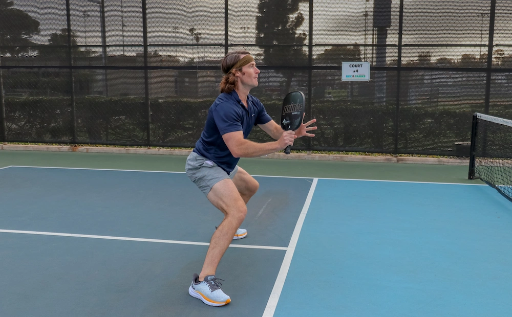 Brandon positioning behind the kitchen for a volley