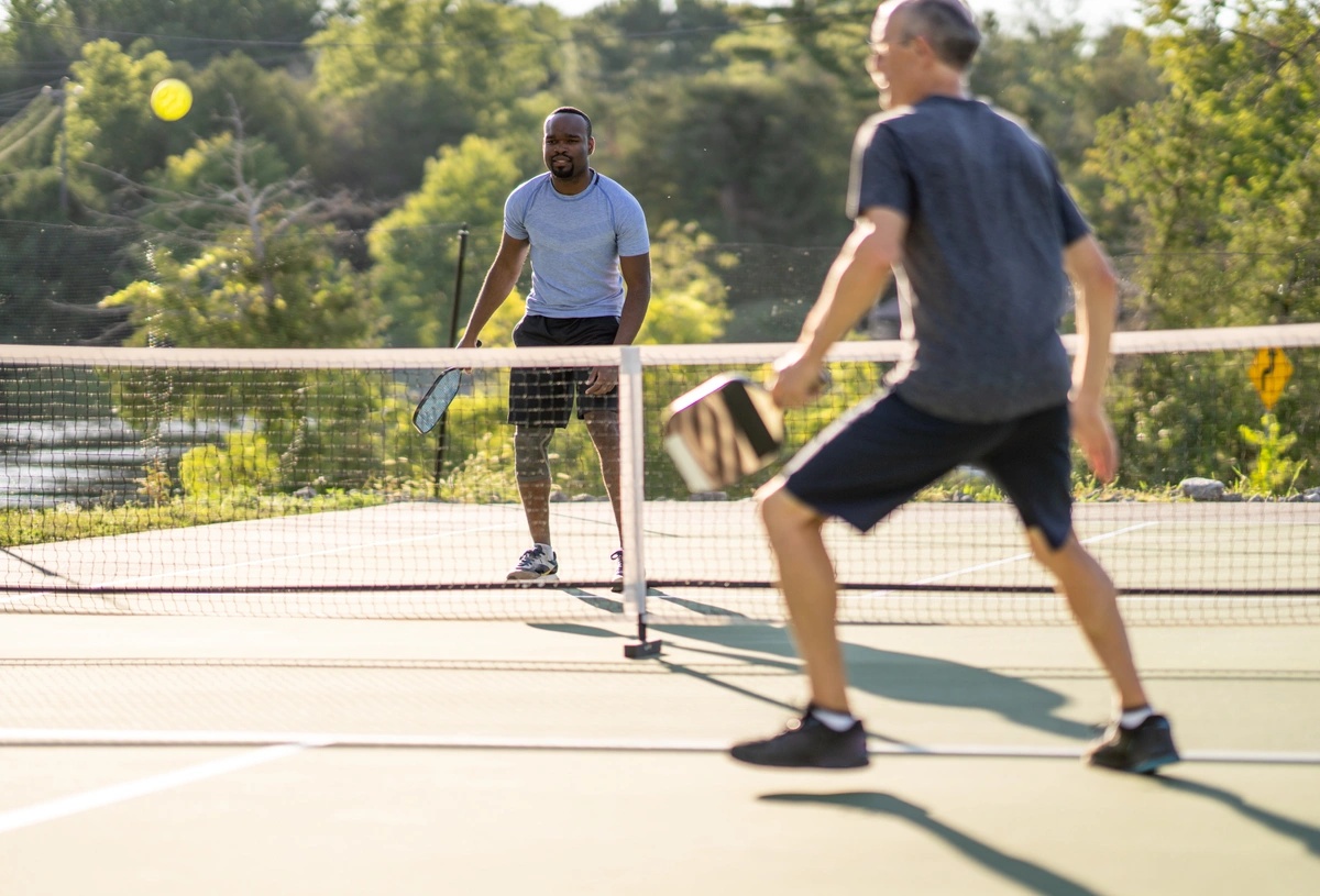 Two men playing pickleball