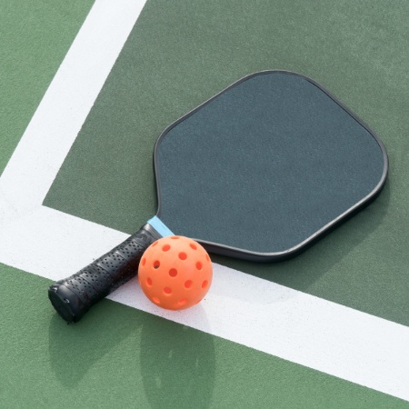 Photo of a Pickleball Paddle with Ball