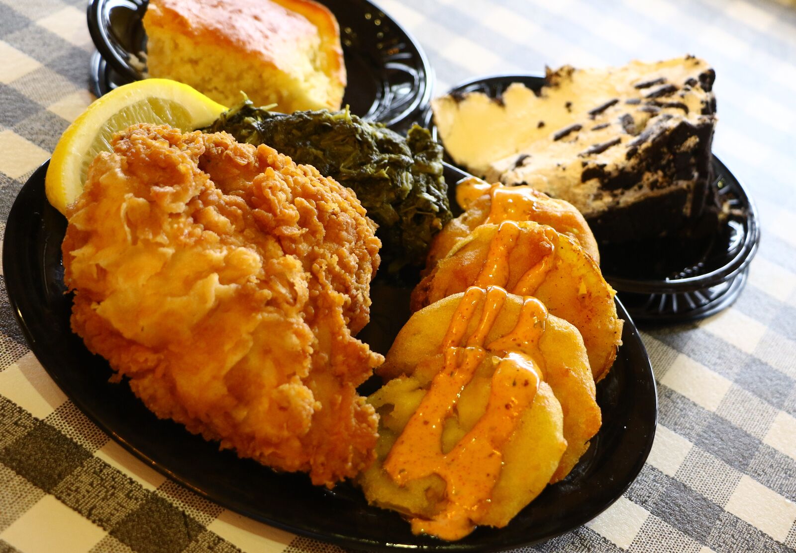 Platter of fried chicken, greens, and potatoes