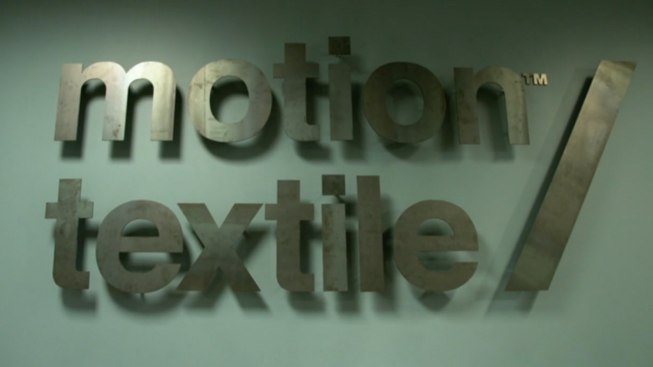 Motion Textile's logo from their production facility's office.