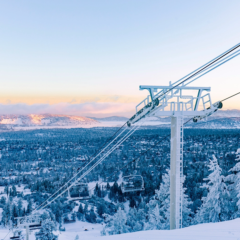 View of a ski lift at sunset.