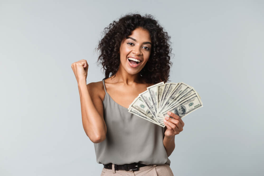 woman happy with payday loan cash