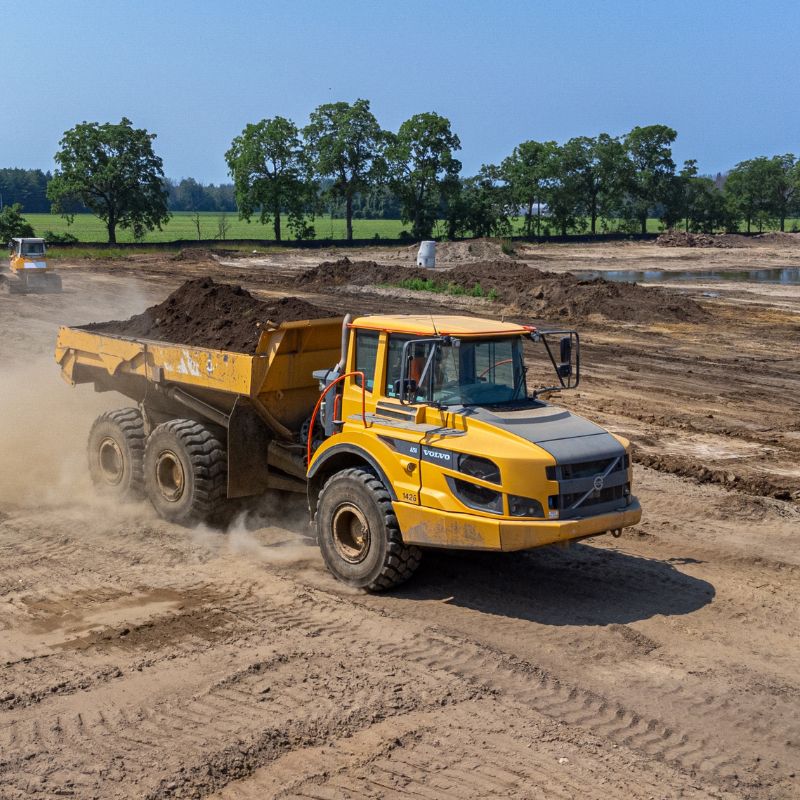 Volvo CE articulated dump truck moving dirt
