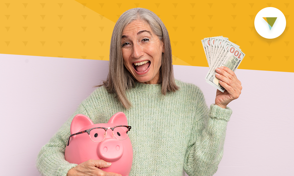 Woman holding money and piggy bank.