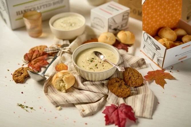 Loaded Baked Potato soup surrounded by fall deorations and cookies.