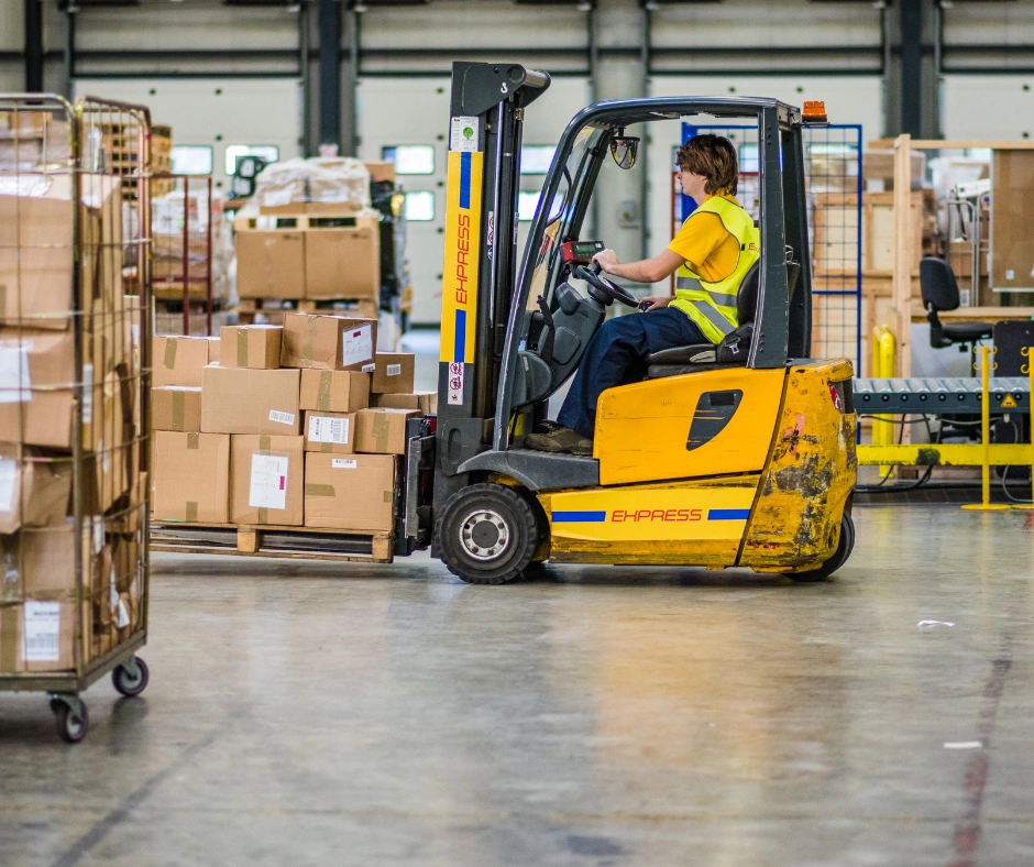 forklift moving boxes on pallet