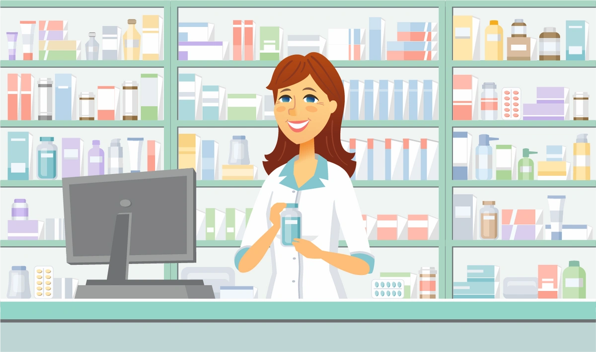 pharmacist standing behind the pharmacy counter