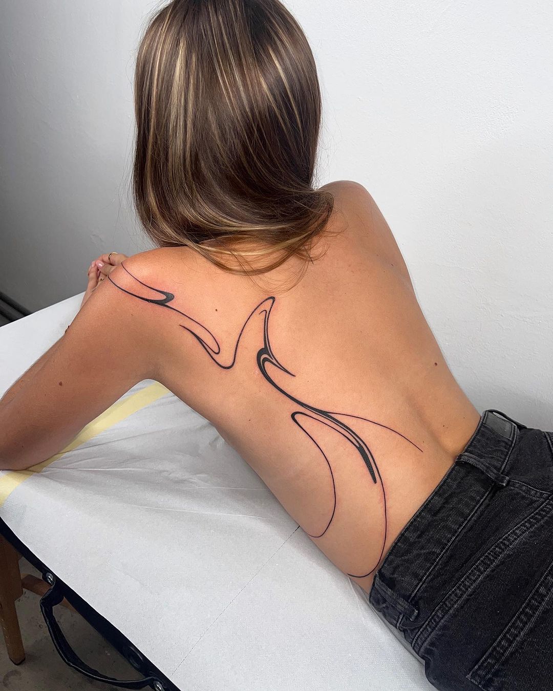girl back abstract tattoo by tattoo artist nakkab