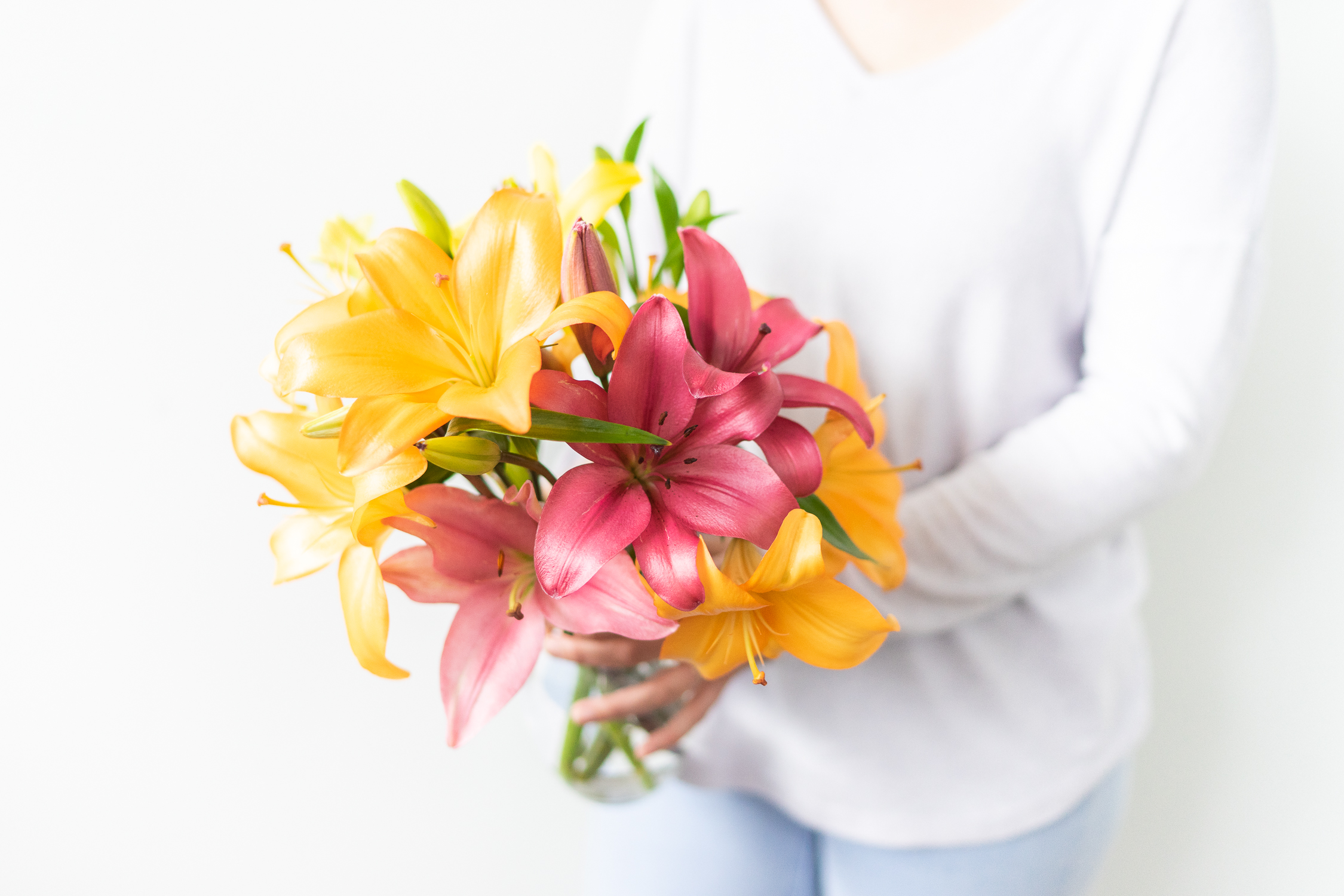 Lady Holding Bouquet of Lilies