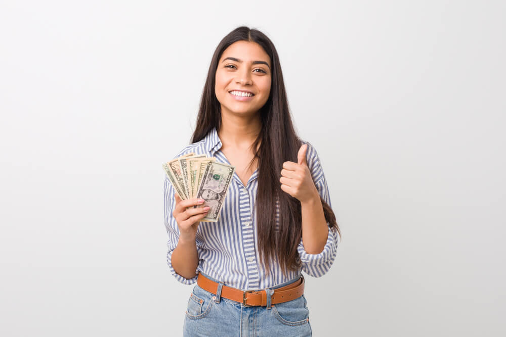 woman happy from payday loan cash