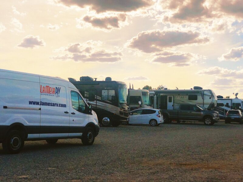 A group of vehicles parked in a parking lot